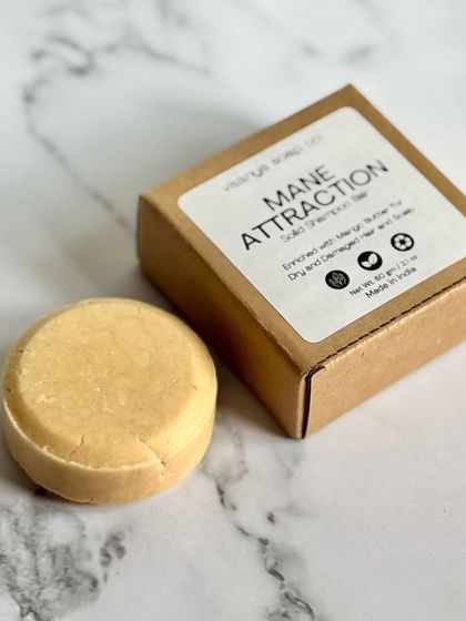 A closer look at our 'Mane Attraction' solid shampoo bar. Packed with Mango Butter, Yellow Clay, and Oat Protein, this bar delivers deep hydration and softness.