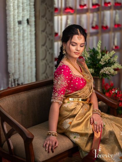 A serene moment captured. The soft, traditional makeup look is perfect for a Muhurtham, creating an aura of ethereal beauty and grace.