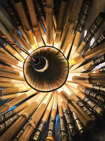 An inside look at a bundle of bamboo clatter sticks being made. The construction is simple but very specific to create the right sound and durability.