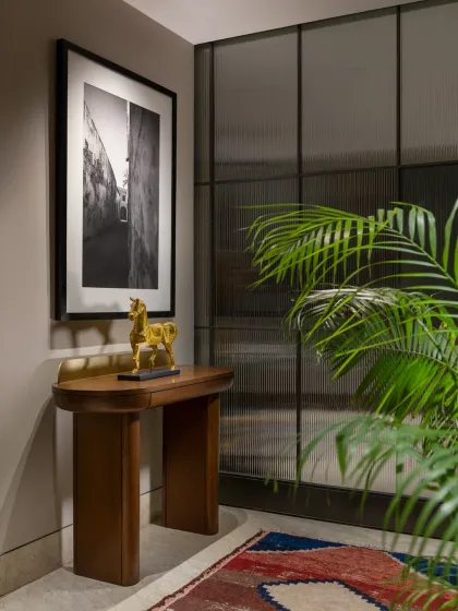 The entrance to the SDA Project features this elegant console from our Koko by K2India collection. Its clean lines and warm wood finish provide a perfect surface for a curated display of art and sculpture, setting a sophisticated tone for the home.