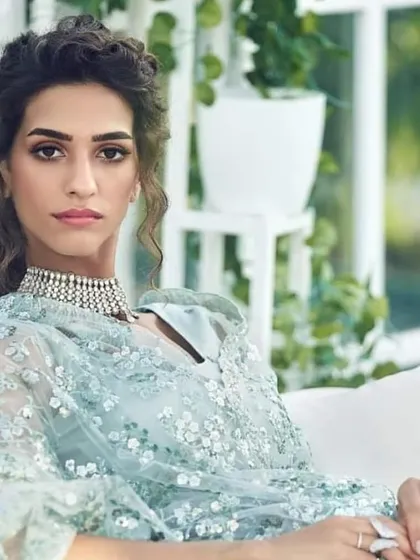 This is a complete reception or engagement party look. The makeup is glamorous yet sophisticated, with defined eyes and a balanced lip, paired with a soft, curly hairstyle. I ensure the final look works beautifully with your outfit, jewelry, and the event's ambiance.