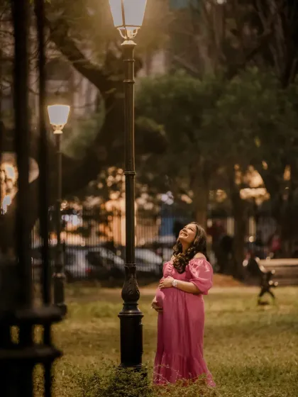 Even in an outdoor park setting, I use available light, like this lamppost, to create a cinematic feel. Anisha's joyful, upward glance feels spontaneous and full of hope.
