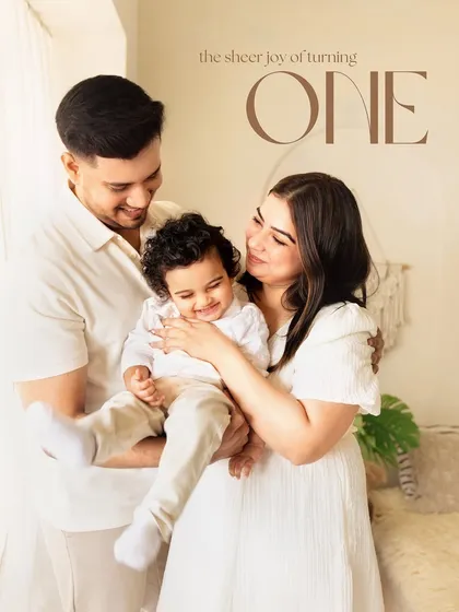 The sheer joy of turning one. This family portrait perfectly captures the happiness and love surrounding this major milestone.