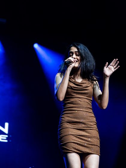 Waving to the crowd during the Dallas concert.