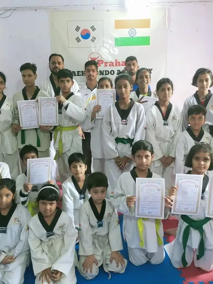 A large group of our junior students celebrating their belt promotions together.