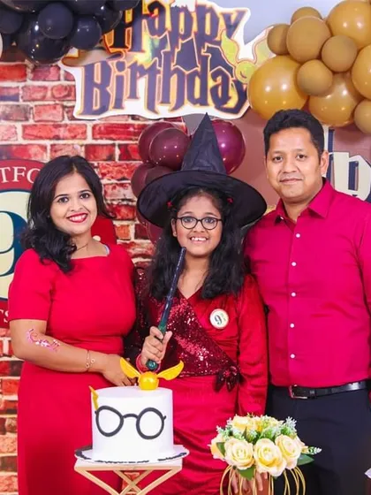 Welcome to Hogwarts! We brought the magic of Harry Potter to this 12th birthday with a complete themed setup, including a Platform 9 3/4 photo wall, house banners, and even a custom cake. The whole family got into the wizarding spirit for this memorable portrait.