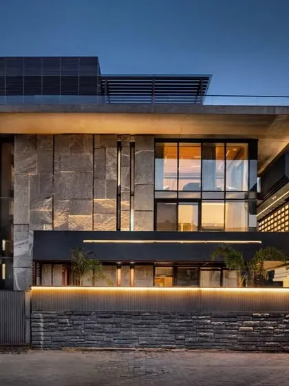 The 'Green Court Villa' in Civil Lines, Delhi. The design was inspired by the desire to live in constant contact with nature, combining open grounds and landscaped areas to bring joy and positivity to the home.