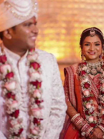 A candid shot of the bride and groom. Her makeup looks fresh and natural, capturing her beauty in a simple, elegant way.