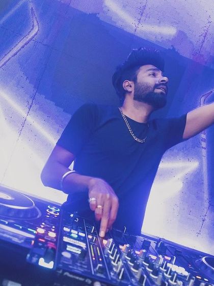 In action at SinQ, Goa, with my arm raised, feeling the music.