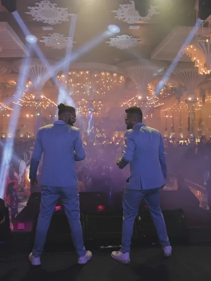 Facing a sea of happy faces is what we live for. This shot captures the moment we connect with the crowd, turning a beautiful wedding reception into a full-blown concert experience with epic lighting and sound.