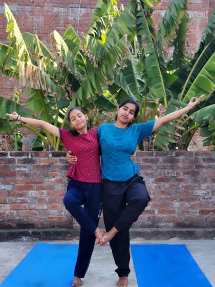 Partner yoga is a great way to build trust and connection. Here, my student and I practice a supported Tree Pose, finding balance together.