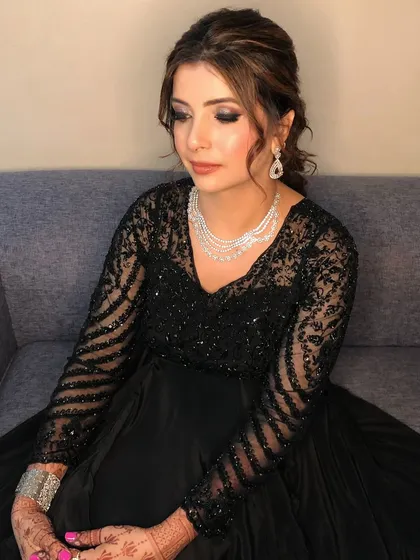 A portrait of the Sangeet client, her ponytail adding a touch of modern glamour.