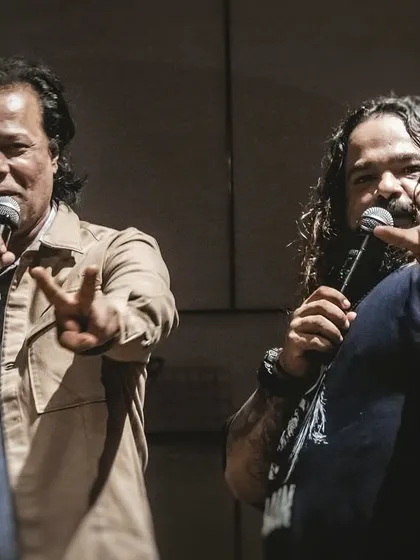 A moment of connection. Here's our frontman sharing the mic with the MD of Shapoorji Pallonji. We believe in making music an interactive experience, creating memories that go beyond just a performance.