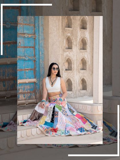 A cool and casual pose in the patchwork lehenga, paired with sunglasses for a modern vibe.
