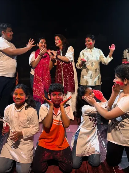 Capturing a candid moment of fun and laughter during our studio's Holi dance event.