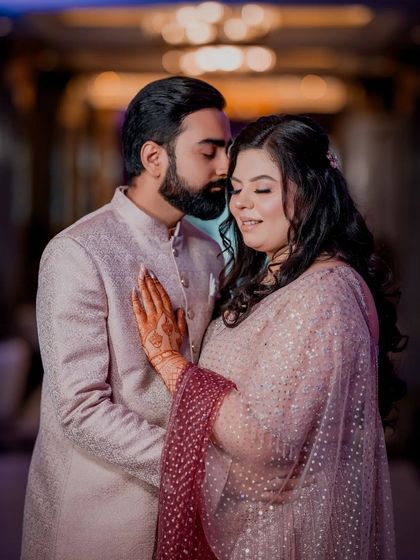 An intimate embrace during their Roka ceremony. This photo captures the quiet love and happiness of starting their new journey together.