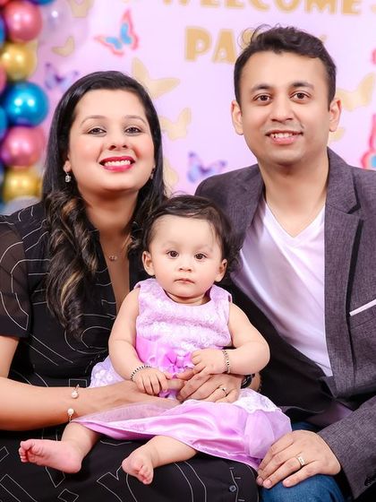 A thrilling 'Race Car' themed birthday party, with checkered flags, car cutouts, and a custom racetrack backdrop, perfect for little speed enthusiasts.