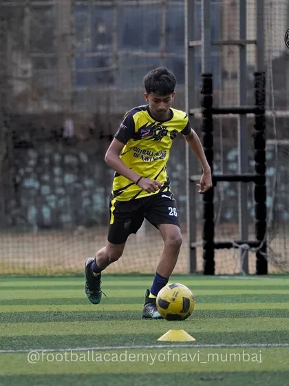 A player navigates a cone drill at our Koparkhairane center, focusing on sharp turns and ball control.