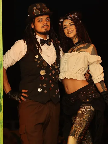 Our Steampunk duo in character. This theme features Victorian-inspired fashion mixed with industrial gears and goggles for a unique retro-futuristic look.