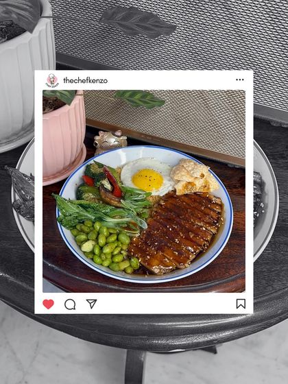 A perfectly plated Teriyaki bowl with a sunny-side-up egg, edamame, and grilled chicken, ready for its close-up.