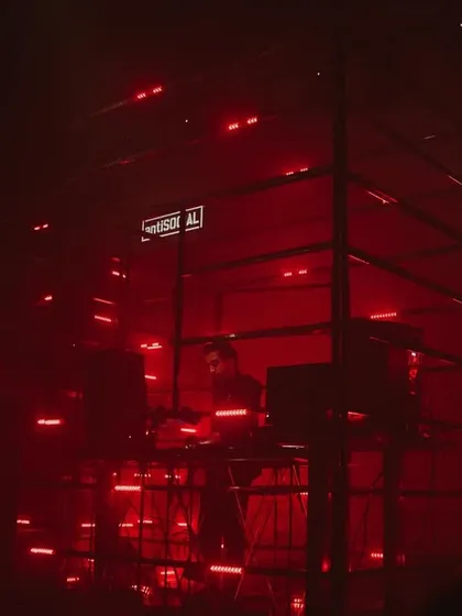 I love playing in unique settings. Here I am inside a custom LED cage at a show in Bombay, surrounded by red lights. This kind of immersive audio visual setup helps me build a deep, hypnotic techno journey for everyone in the room.