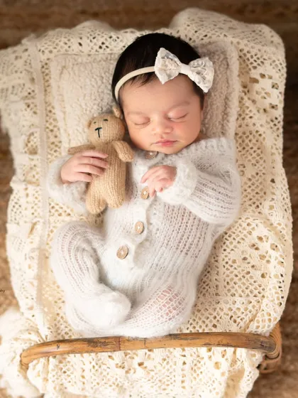 A sleeping newborn is one of the most peaceful sights in the world. I gently posed this little angel with her tiny teddy bear, capturing her innocence in a soft, timeless portrait.