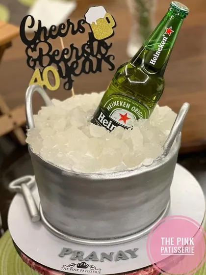 "Cheers & Beers" to 40 years! This incredibly realistic cake looks just like a bucket of ice with a Heineken beer bottle, complete with an edible bottle opener.