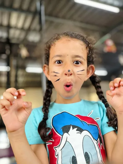 A playful "rawr" from our little studio cat. We love to have fun and be silly during our kids' classes, making it a place they are excited to come to.