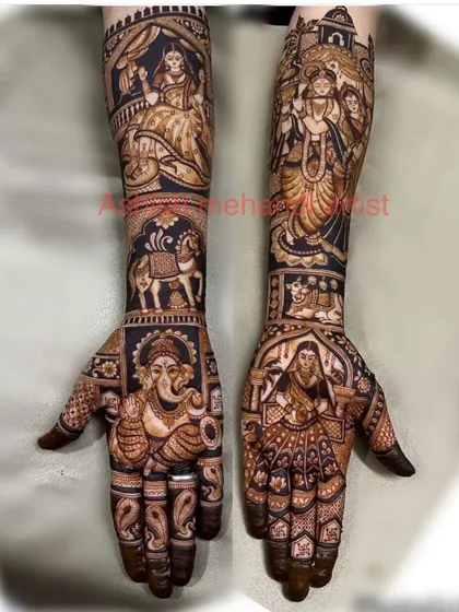 A divine bridal mehandi featuring a large portrait of Lord Ganesha on one palm and Goddess Lakshmi on the other, surrounded by wedding motifs.