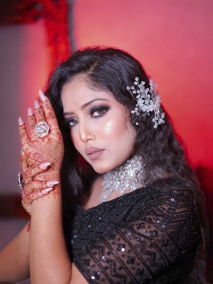 A close-up on the dramatic smokey eye makeup and the sparkling diamond choker.