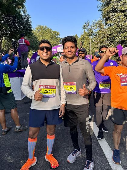 Two of our members at the starting line of the 10k. The support system here means you're never running alone, even in a crowd of thousands.