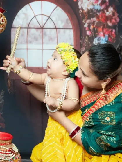 A mother and her baby share a tender moment during our Janmashtami mini session. We provide the baby's outfit and accessories for the shoot.