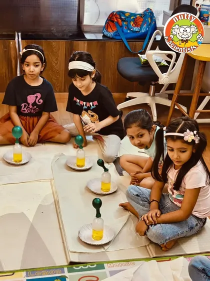A row of little scientists, each intently focused on their self-inflating balloon experiment. It's a great activity for learning about cause and effect.