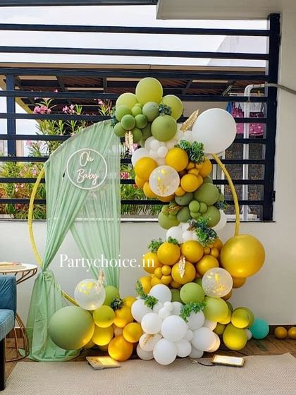 A full view of the "Oh Baby" ring backdrop, perfect for a chic and contemporary baby shower celebration at home.