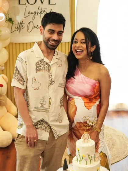 The purest joy is seeing the parents to be glowing. Capturing these happy, candid moments is the ultimate goal of every celebration I plan. Here, the couple shares a laugh by their custom cake, surrounded by the beautiful decor of their teddy bear themed shower.