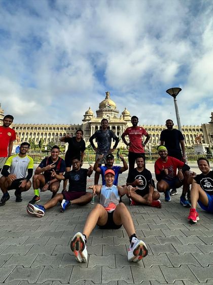 Another great shot of our running crew posing in front of the Vidhana Soudha. We are proud to run in our city and represent our community.