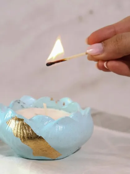 Lighting up one of our pastel blue Lotus Jars. This simple act is all it takes to add a warm, festive glow to your space.