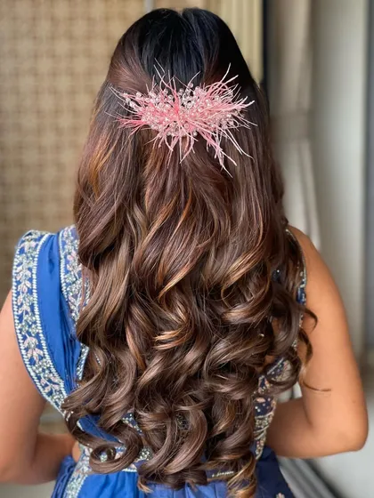 The back view of the Roka hairstyle, showing the unique pink hair accessory.