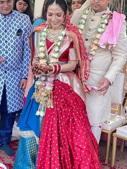 It’s moments like these that I live for. Seeing a bride look this radiant on her wedding day in a custom Tehhzeeb lehenga is the greatest reward. We combined a traditional red bandhani with a rich blue brocade to create this unique bridal look.