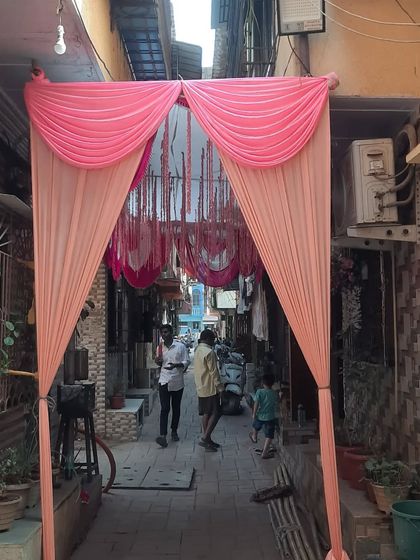 A simple draped entrance for a function being held in a narrow residential lane.
