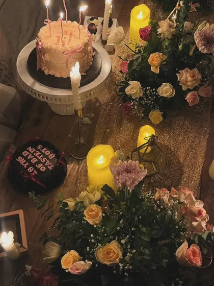 We designed this moody and floral low-seating setup for an 18th birthday celebration. The warm glow from numerous candles highlights the lush flower arrangements and birthday cakes, creating a magical and aesthetic vibe.