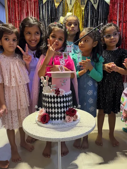 A magic themed birthday party isn't complete without a magical cake moment. Here are the birthday girl and her friends, wands and cards in hand, ready to celebrate. I love adding that extra bit of sparkle to make their special day unforgettable.
