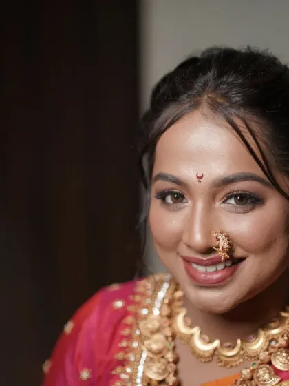 A classic portrait of a Marathi bride, her eyes sparkling with happiness.