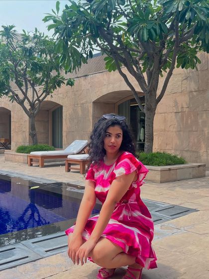 A different outfit, a pink tie-dye dress, but the same mood. This shows my love for colorful, easy-to-wear summer dresses.