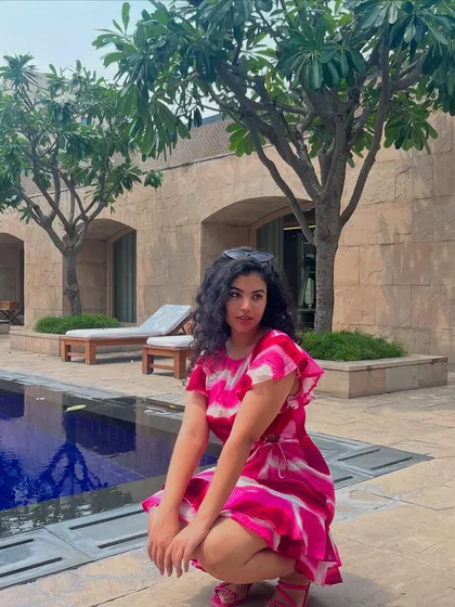 A pop of color for a poolside look. This pink tie-dye dress is so fun and vibrant, perfect for a summer staycation.