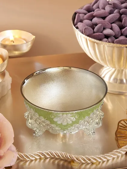 The lime green enamel bowl shown in a festive setting, ready to be filled with treats. The shimmering silver interior contrasts beautifully with the colorful exterior.