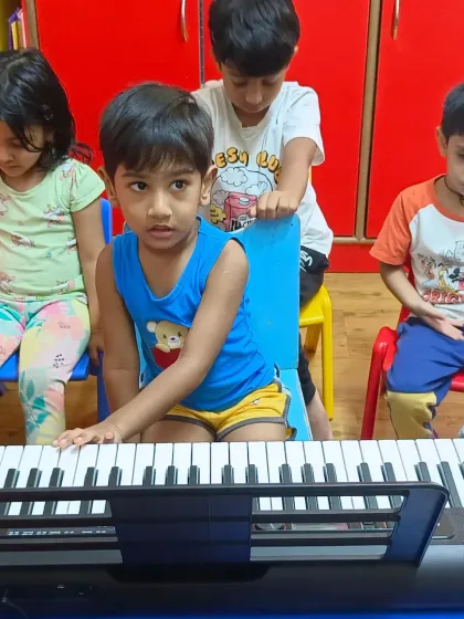 Teamwork makes the dream work. Students in our music camp learn together, exploring the Casio keyboard and taking their first steps in playing music.