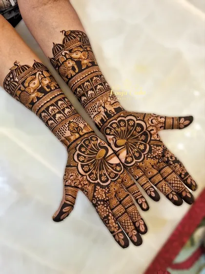 Henna is for everyone in the family. I created this full-coverage, traditional design for the groom's mother, incorporating majestic elephants and blooming peacocks to celebrate her important role in the wedding festivities.