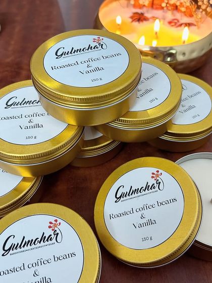 A collection of coffee and vanilla candles with one of my premium urli candles in the background. It shows the range of styles I offer.