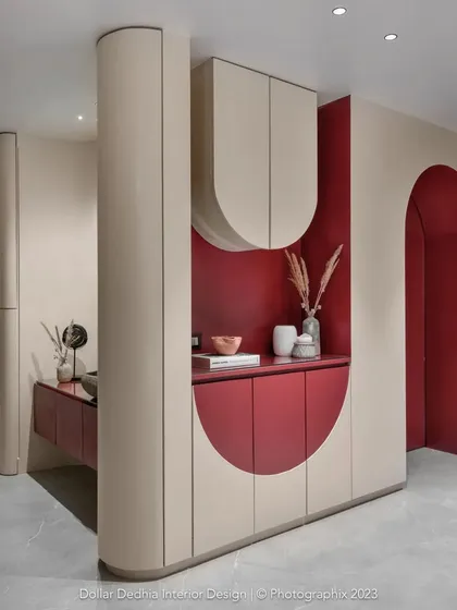 In cities like Mumbai, smart storage is everything. This integrated unit was my solution for a passage area, hiding a washing machine, crockery, and shoe storage behind a beautiful, wave-inspired facade.